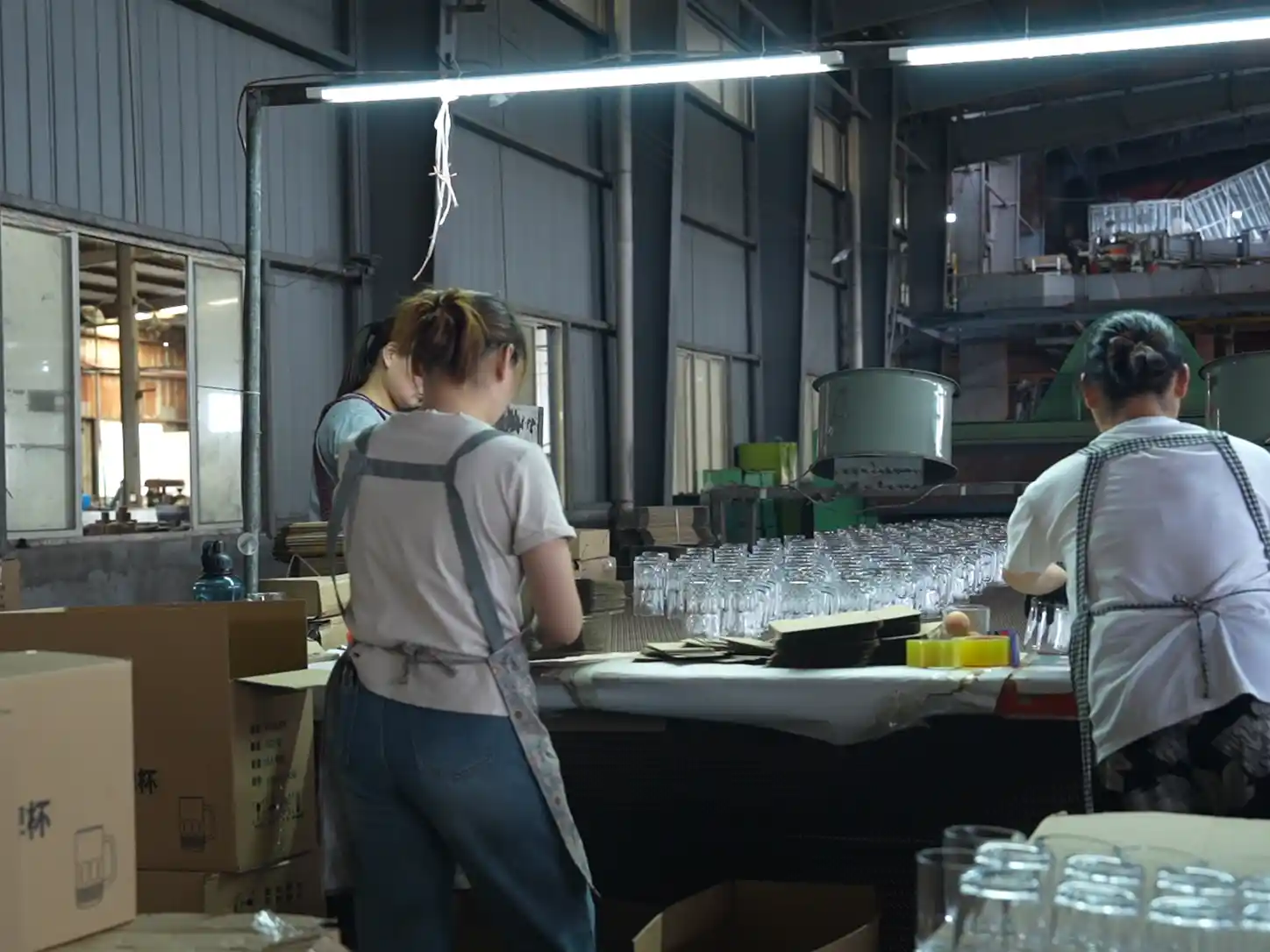 Factory packing area for retail packaging and export cartons